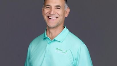 Dr. Jesus Bernal demonstrates hip mobility and standing posture guidance, MueveFlex Wellness Center Tucson