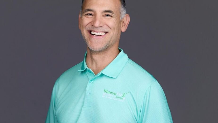 Dr. Jesus Bernal demonstrates hip mobility and standing posture guidance, MueveFlex Wellness Center Tucson